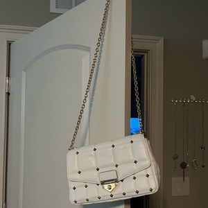 Brand new, paid $580 for it. very elegant and spacious for a crossbody